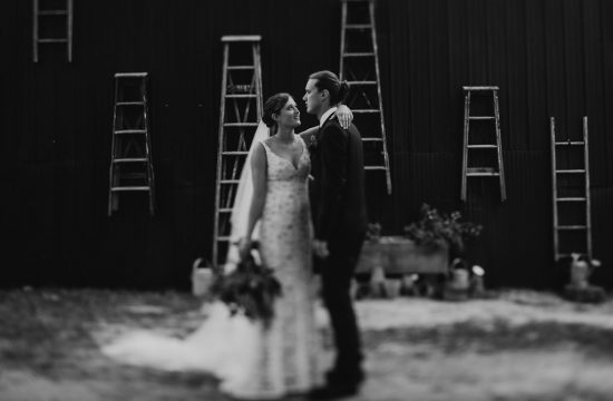Black and white wedding photograph of Bride, Alex, and groom, Tom at their wedding at The Woods Farm on the south coast