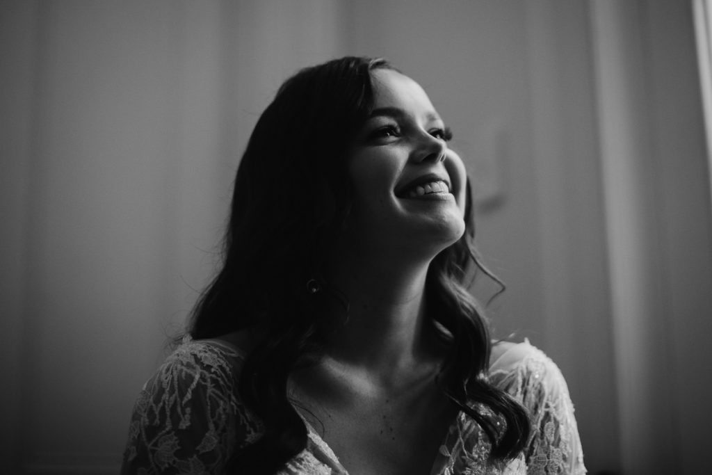 Black and white potrait of a bride laughin on her wedding day: Bendooley Estate Wedding Photographer; Southern Highlands Wedding Photography