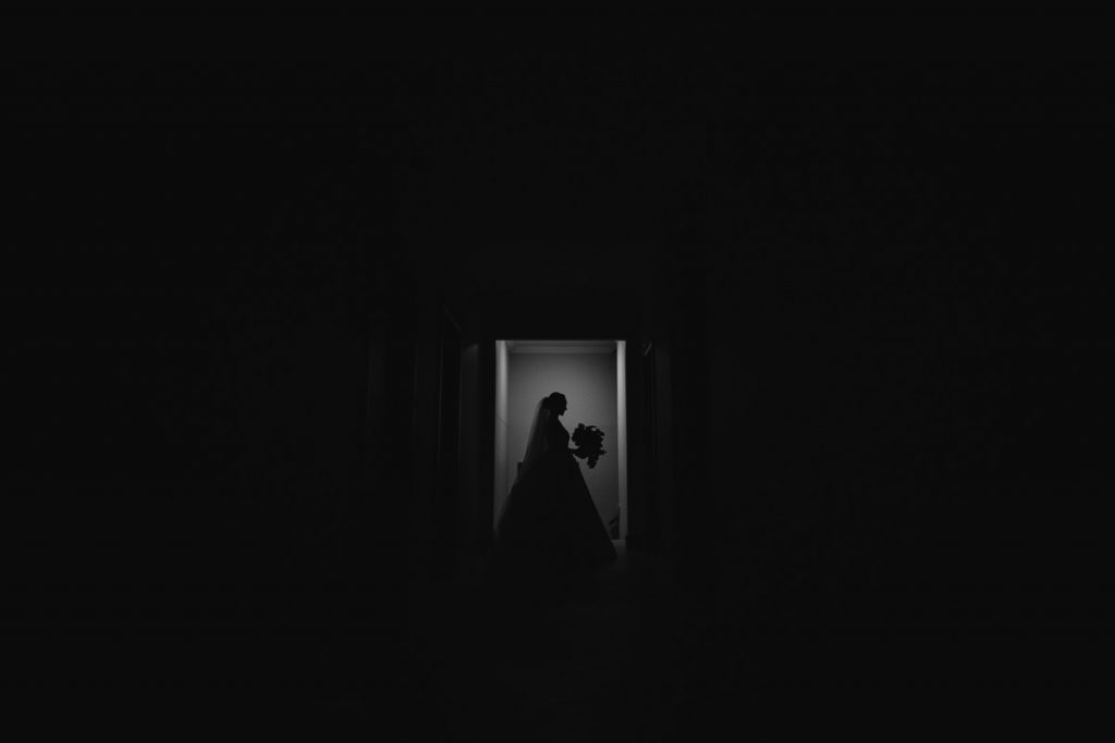 Creative black and white silhouette portait of a bried in a doorway at her Bendooley Estate in the Southern Highlands