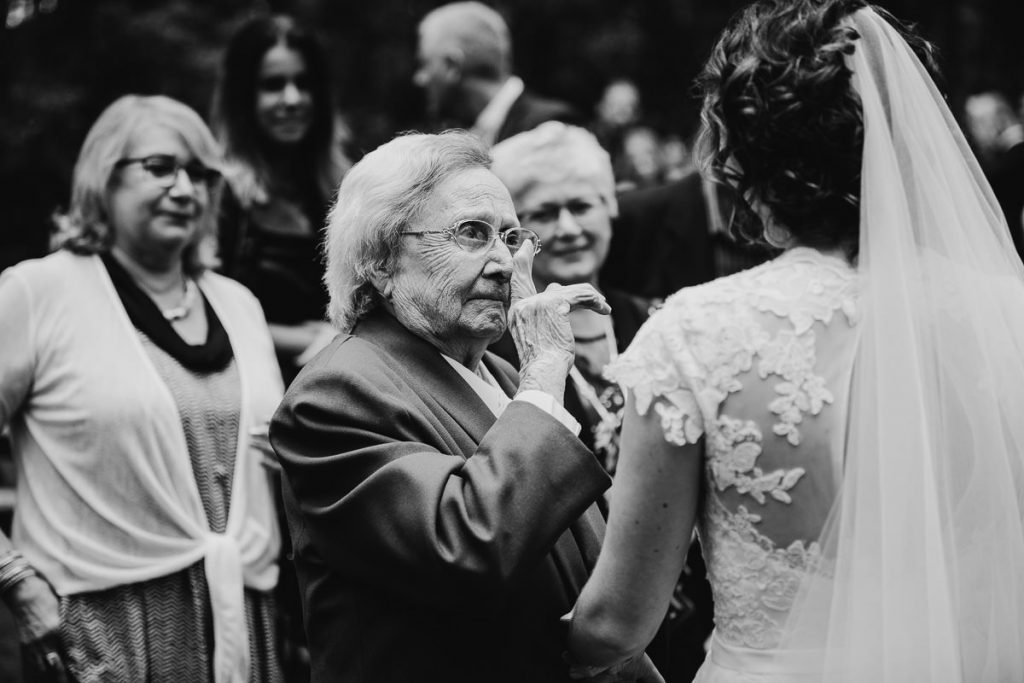 Black and white portrait of granmother tearfully congratulating the bride at her Bilpin wedding