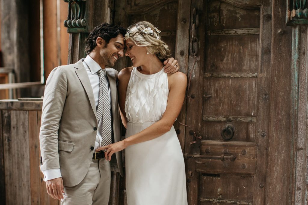 Bride and groom lovingly touch foreheads at their Mercure venue wedding in Gerringong