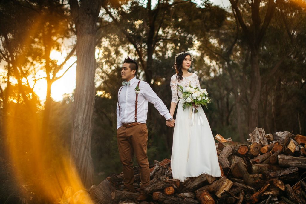 Bride and groom contemplating life while holding hands in the forest at their wedding at Growwild Wildflower Farm