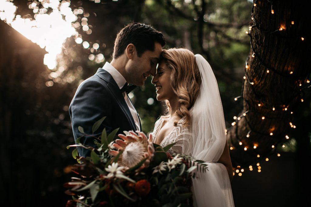 Bride and groom touching forheads lovingly at their Jaspers Berry wedding
