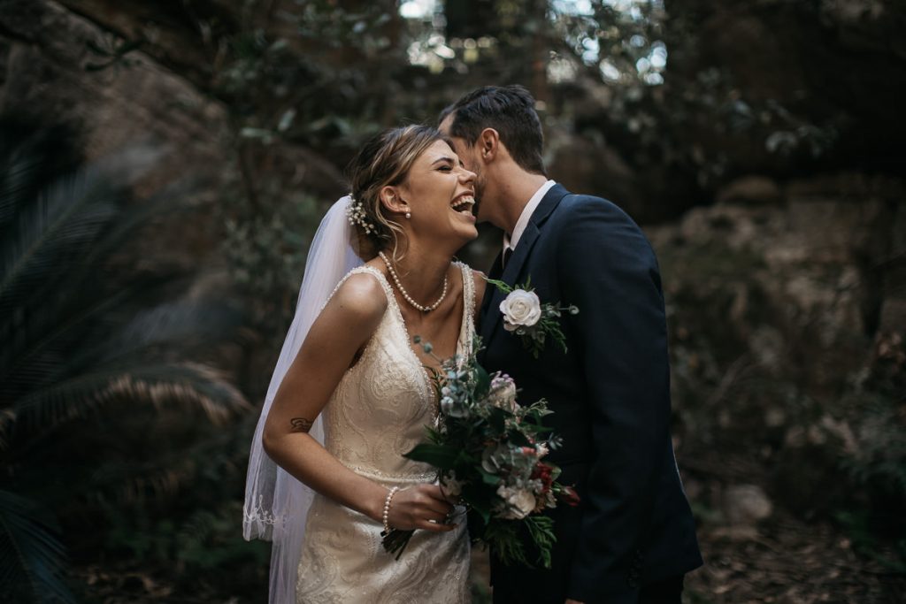 bride and groom share a funny secret; Kangaroo Valley Bush Retreat Wedding photography