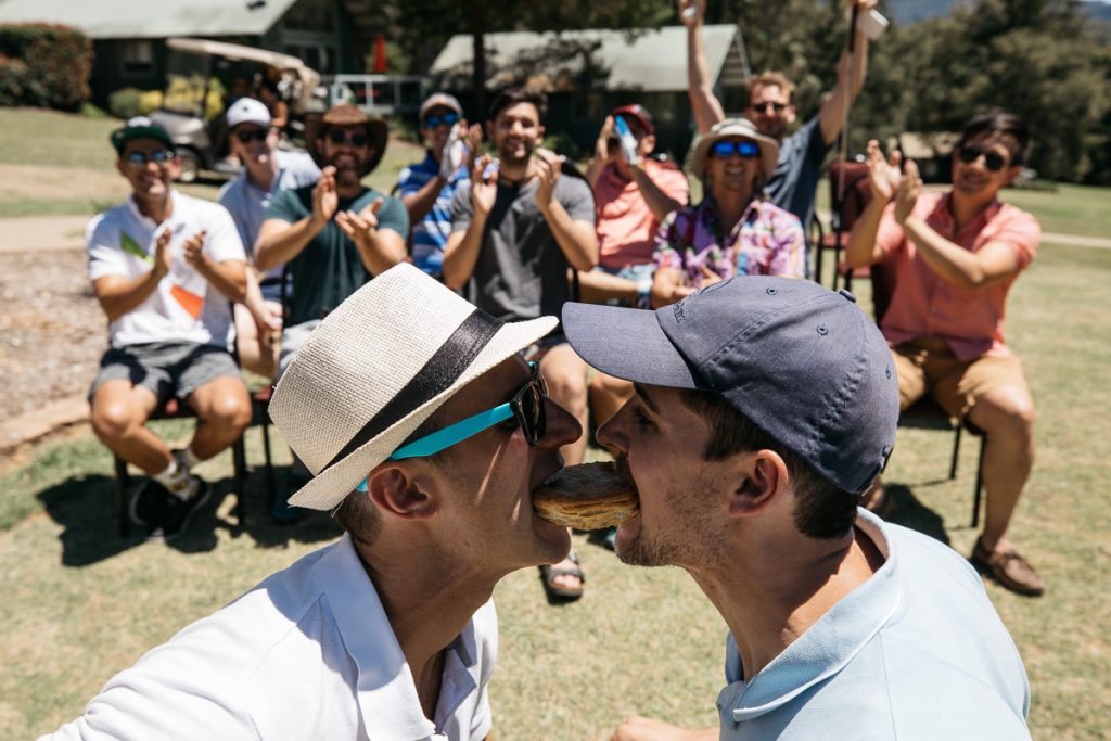 Pre-wedding fun for the groom - trying to eat a pie together; Kangaroo Valley Bush Retreat Wedding Photographer