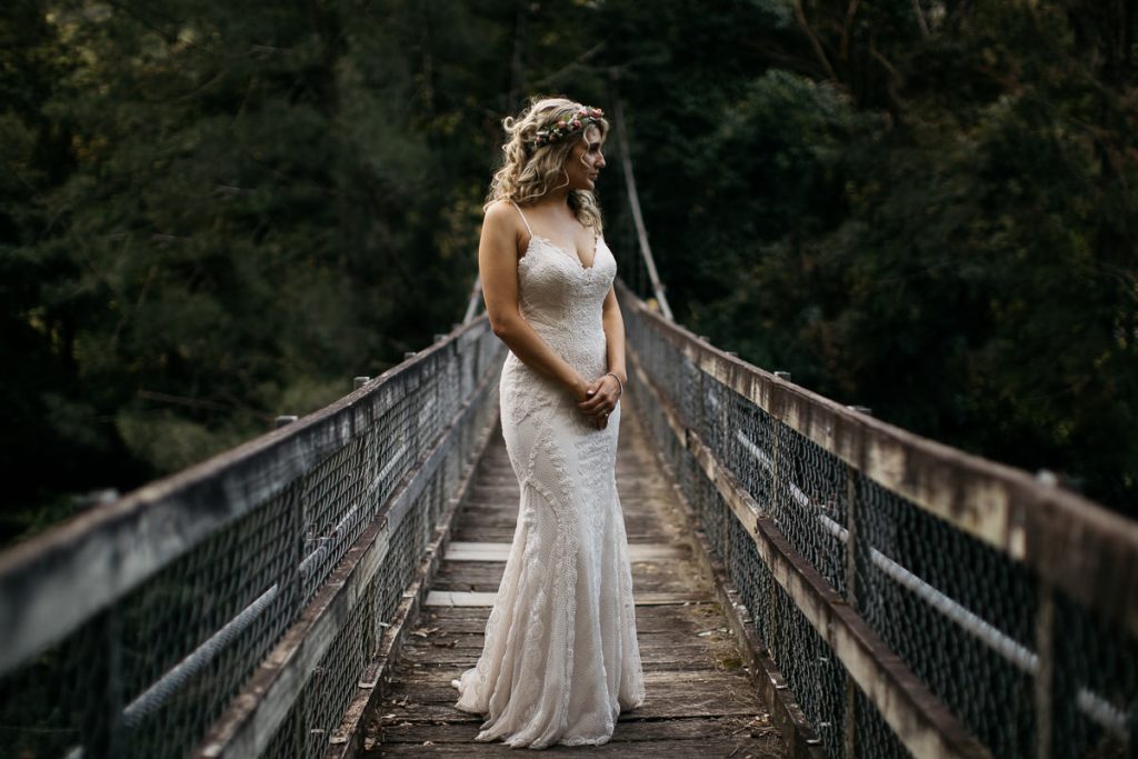 bride on the swing bridge at her Kangaroo Valley Bush Retreat Wedding; Wedding Photography South Coast