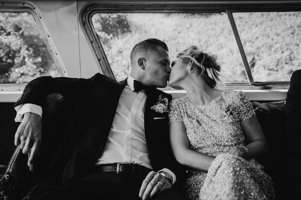 Bride and Groom kiss in the car; Black and white image; Kiama; South Coast Wedding Photographer