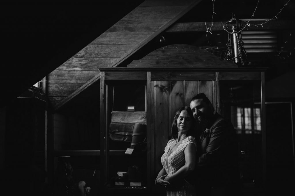 Black and white photo of bride and groom in a stable; Bowral Southern Highlands Wedding Photographer