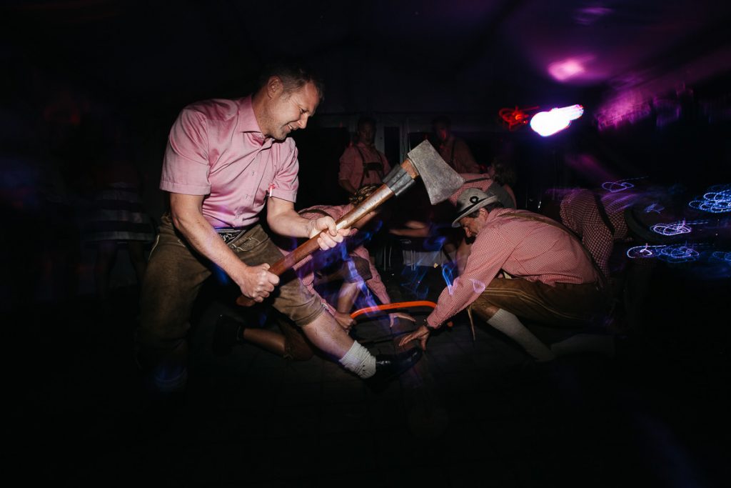 Groom and groomsmen jokingly pretend to do woodwork; South Coast Wedding Photographer