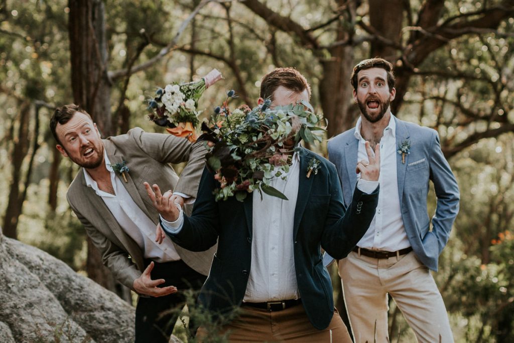 Wedding bouquet thrown at groom's head; Southern Highlands Wedding Photography