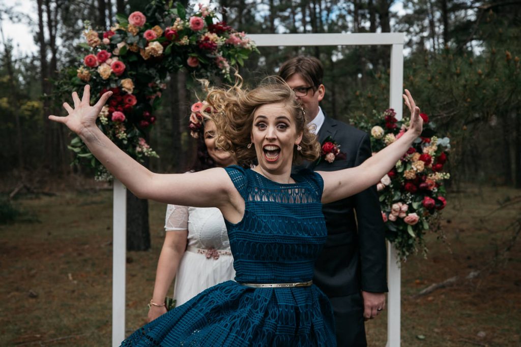 bridesmaid does a silly pose for the wedding photographer; Southern Highlands
