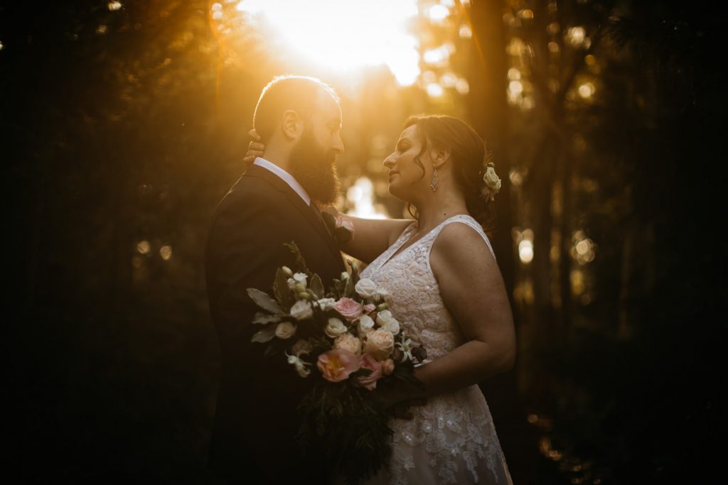 Bride and groom lovingly look at each other as the sun sets behind them at their Burrawang wedding; Southern Highlands Wedding Photography