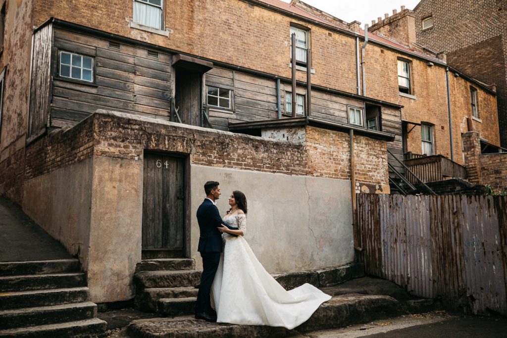 Couple pose in front of number 64; Sydney Wedding Photographer